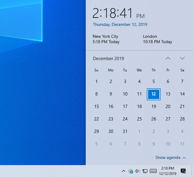 Panel jam Windows 10 menunjukkan waktu dalam tiga zona waktu.