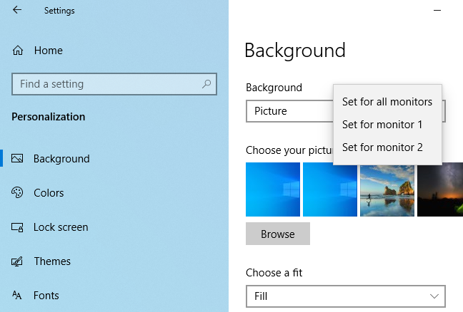 Mengatur wallpaper berbeda untuk monitor berbeda di Windows 10.