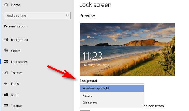 Di pengaturan layar Kunci Windows 10, klik menu tarik-turun "Latar Belakang" dan buat pilihan.