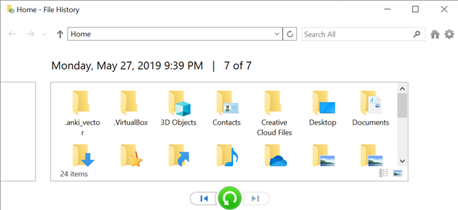 Dialog pemulihan riwayat file, menampilkan folder yang telah disimpan.