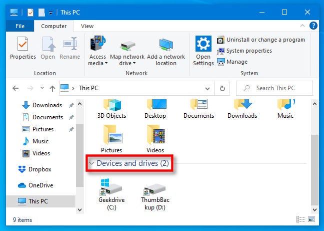 Di PC ini, temukan bagian "Perangkat dan drive" di Windows 10 File Explorer.