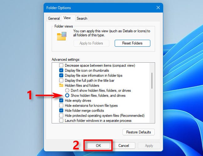 Pilih "Tampilkan file, folder, dan drive tersembunyi" dan klik "OK."