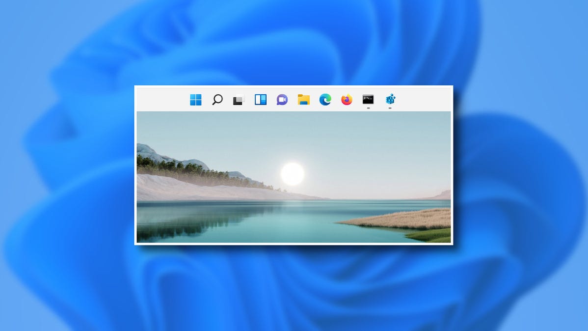 Bilah tugas Windows 11 di bagian atas layar.