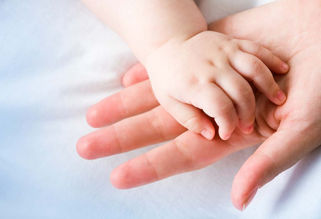 IBU HOLDING BABY'S HAND