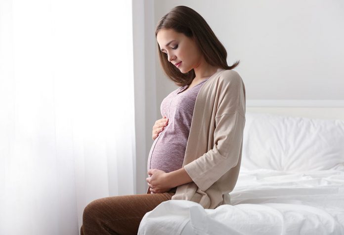 Bagaimana Bangun dari Tempat Tidur selama Kehamilan